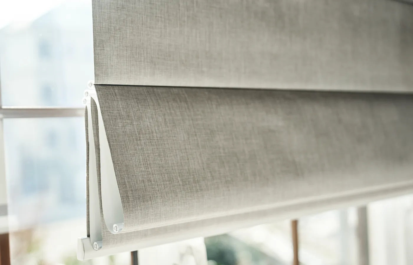 Yoolax Motorized Top down bottom up blackout roman shades offer versatile light and privacy control, allowing separate adjustment of the top and bottom for optimal natural light and privacy in any room