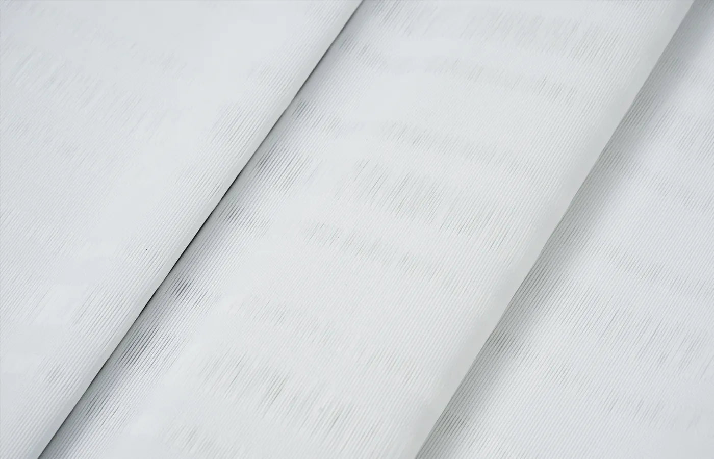 Premium light-filtering fabric with elegant folds enhances comfort and style in any space