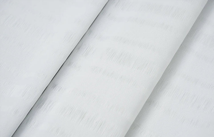 Premium light-filtering fabric with elegant folds enhances comfort and style in any space