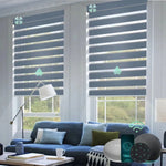 Motorized zebra roller shades with 95% room darkening grey fabric, ideal for soft light control and modern interiors