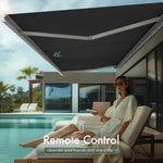 Black motorized retractable awning with remote control to liberate your hands and enjoy life outdoors.