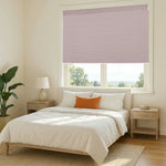 Motorized blackout cellular shades in light pink color for bedroom