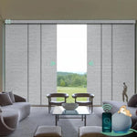Motorized blackout panel track blinds in foggy grey with hardwired motor, ideal for sliding doors and wide windows.