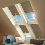 Motorized skylight shades with blackout light coffee fabric, effectively blocking sunlight to create near-total darkness, reducing glare and heat.