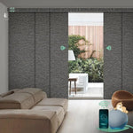 Motorized blackout sliding panel blinds in rock strip black with hardwired motor, ideal for sliding doors and wide windows.