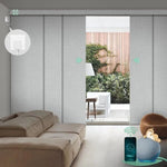 Motorized blackout vertical panel blinds in foggy white with hardwired motor, ideal for sliding doors and wide windows.