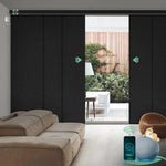 Motorized blackout vertical panel blinds in midnight strip black with hardwired motor, ideal for sliding doors and wide windows.