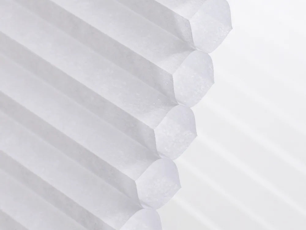 Honeycomb-structured fabric providing sound insulation, thermal insulation, energy efficiency, and all-season comfort.