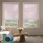 Motorized light-filtering cellular shades in light pink fabric for living room.
