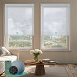 Motorized light-filtering cellular shades in white fabric for living room.
