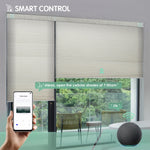 Linen beige motorized light-filtering honeycomb shades controllable via mobile app or Alexa.