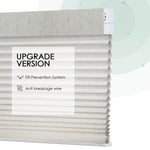 Linen beige motorized light-filtering honeycomb shades with stable design, including tilt prevention system and anti-breakage wire.