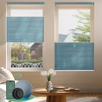 Blue motorized top down bottom up light-filtering cellular shades for flexible light control and enhanced privacy.